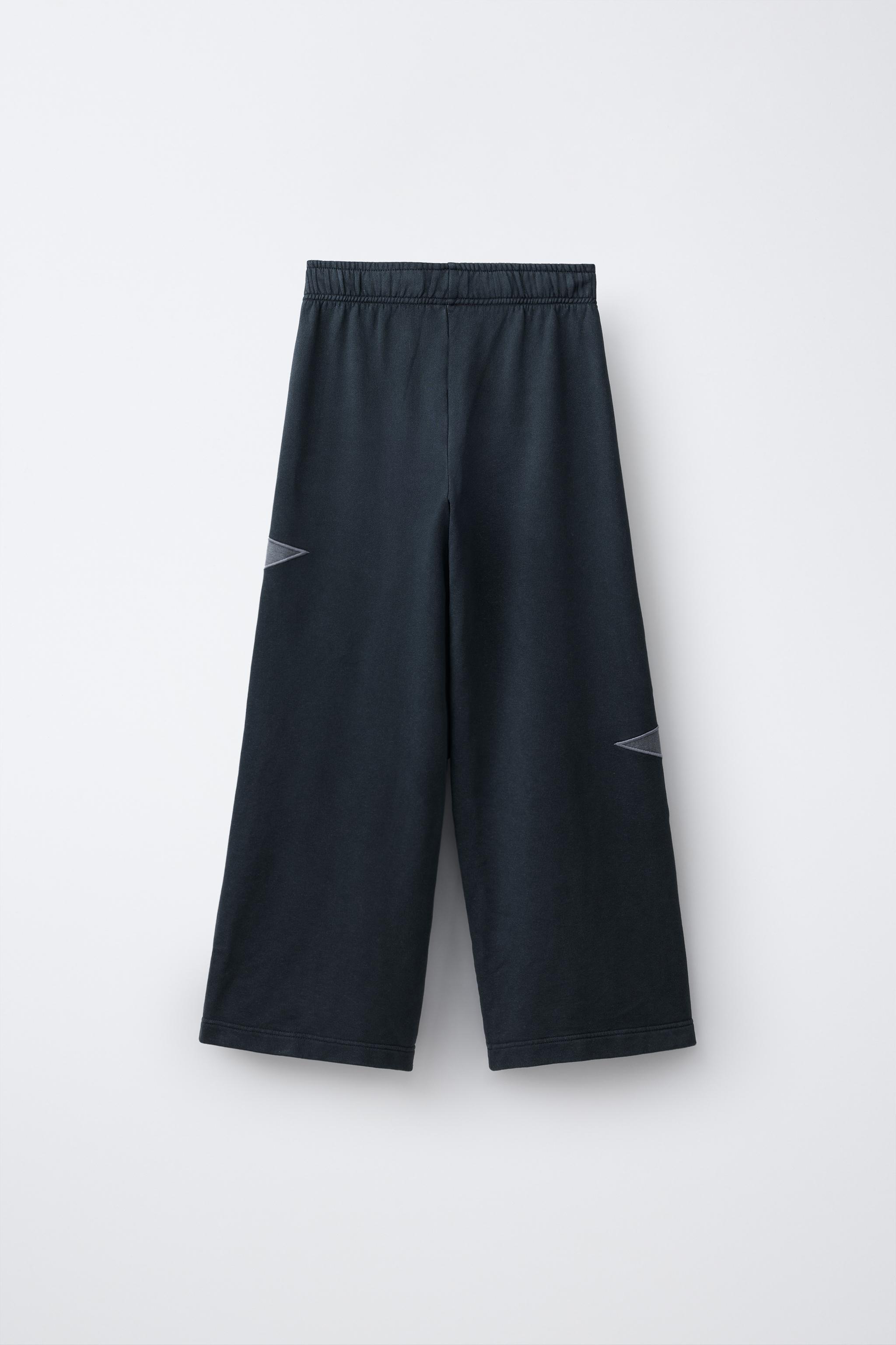 PANTALON EN MOLLETON EFFET DÉLAVÉ À JAMBES LARGES ÉTOILES